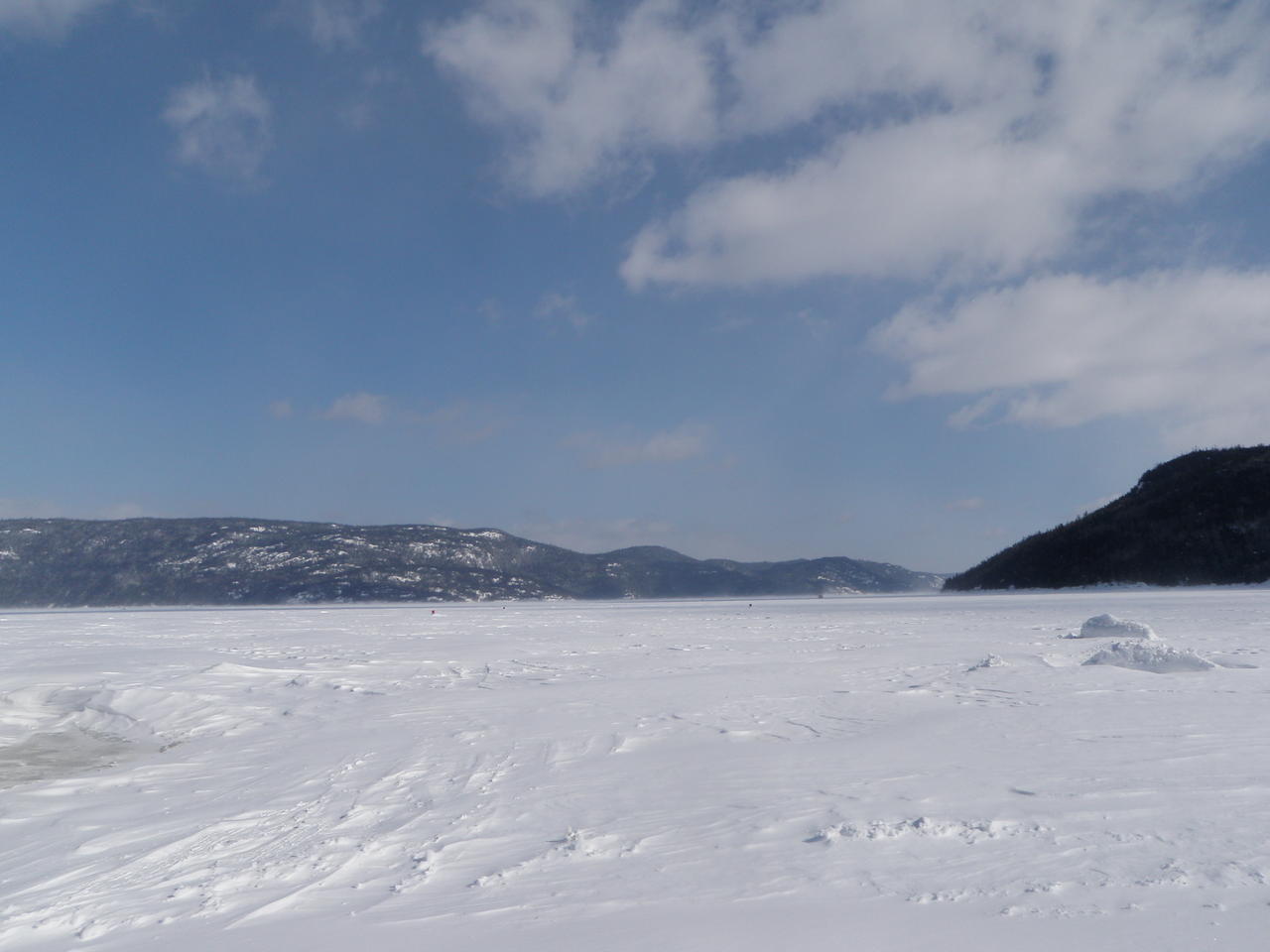 Snowmobile on the Saguenay Fjord, in front off Cap au Leste outfitter
